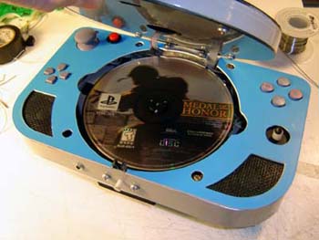 Note the Medal of Honor disc - the one videogame that SHOULD be made into a movie!